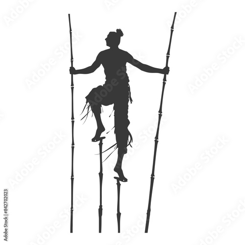 Silhouette of Stilt Walker: Traditional Costume and Balance.