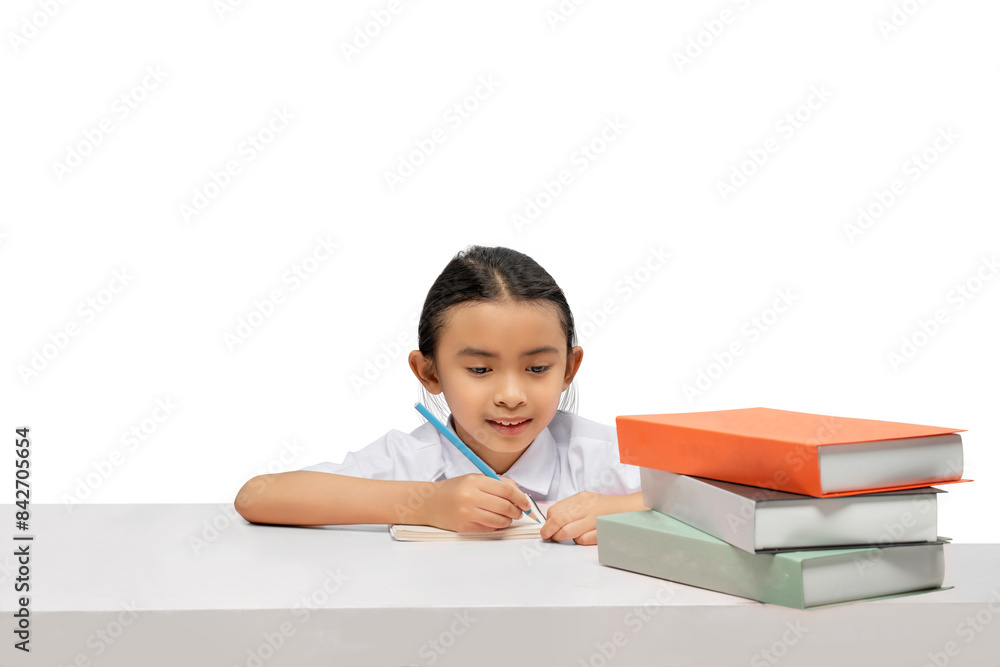 Portrait of an Asian elementary school student girl with a stack of books on the table learning Portrait of an Asian elementary school student girl with a stack of books on the table learning