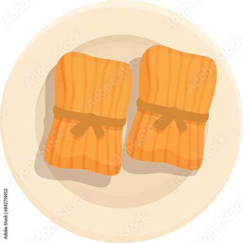 Two tamales wrapped in corn husk resting on a plate