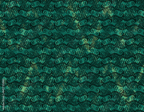 Green fabric with paisley pattern. Indian-style.