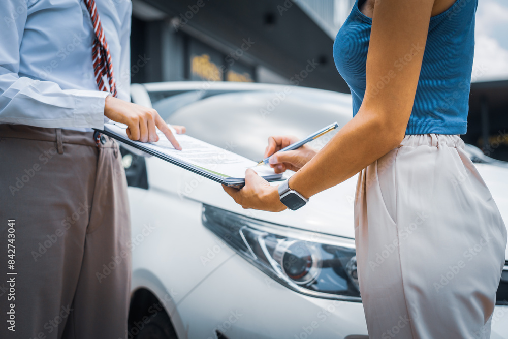 A young businesswoman is navigating car insurance options at her desk, considering premiums, deductibles, and coverage while understanding policies and managing claims efficiently. A young businesswoman is navigating car insurance options at her desk, considering premiums, deductibles, and coverage while understanding policies and managing claims efficiently.