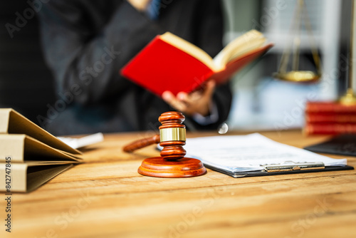 Cuadro en lienzo A young businesswoman is working at her desk, diligently preparing legal briefs and reviewing evidence for an upcoming trial, demonstrating her expertise as a lawyer in litigation and advocacy