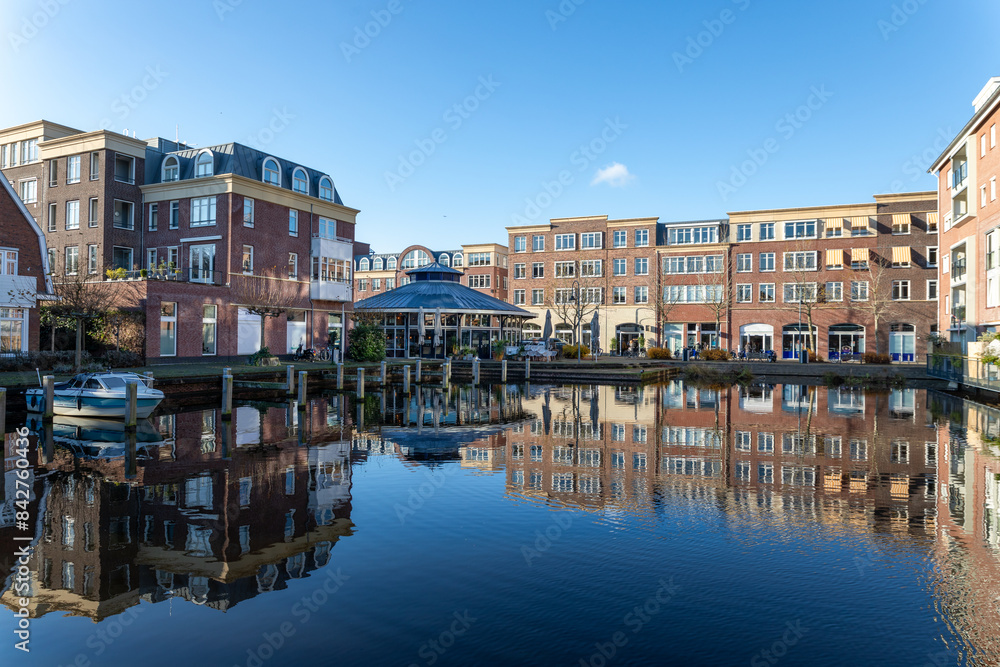 Reflections in the water of the harbor at the Voorhaven quarter in the center of Sassenheim, South Holland in the Netherlands Reflections in the water of the harbor at the Voorhaven quarter in the center of Sassenheim, South Holland in the Netherlands
