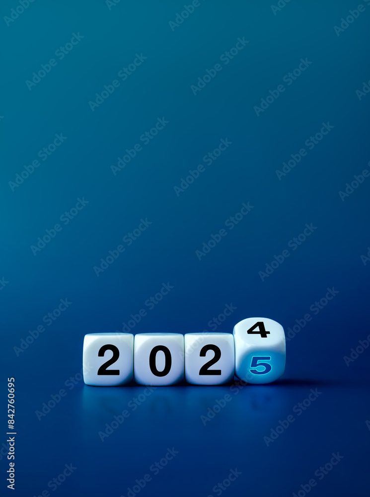 Loading to new year 2025, business and technology banner background concept. Flipping blocks with 2024 change to glow 2025 year numbers on blue background with copy space, vertical, minimal style. Loading to new year 2025, business and technology banner background concept. Flipping blocks with 2024 change to glow 2025 year numbers on blue background with copy space, vertical, minimal style.