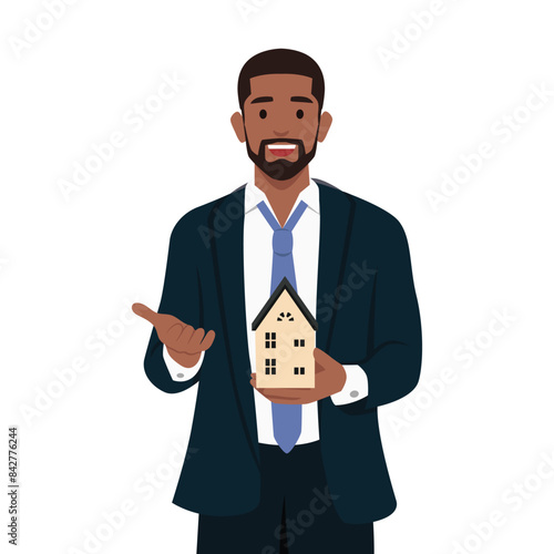 Young bearded business man holding home model and presenting with hand and pointing with finger. Flat vector illustration isolated on white background