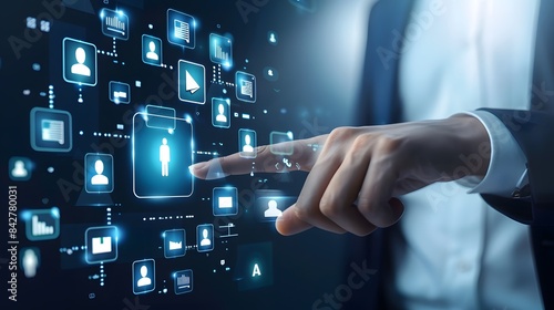 A businessperson touching digital icons in a virtual interface, representing advanced business solutions.