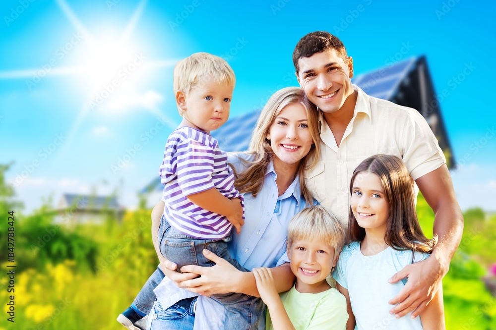 Happy young Family with kids together in a garden Happy young Family with kids together in a garden