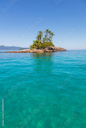 Stunning view of the Botinas Islands on a sunny day, with turquoise sea and blue sky. A true tropical paradise in Angra dos Reis, RJ, Brazil.