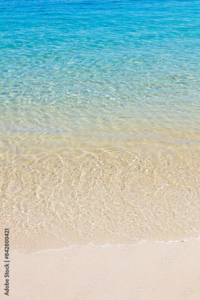 Ripples of the crystal-clear sea waters near the sand of Praia do Dentista, in Ilha Grande, RJ, Brazil. Ripples of the crystal-clear sea waters near the sand of Praia do Dentista, in Ilha Grande, RJ, Brazil.
