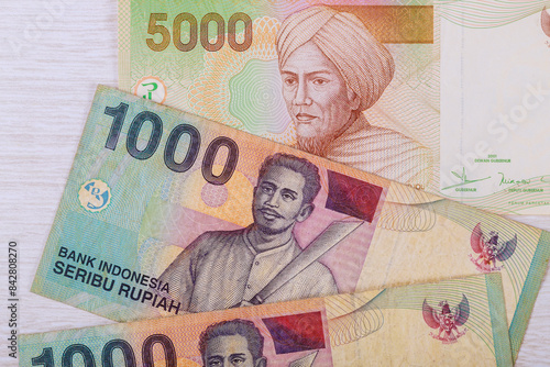 Paper money in form of Indonesian rupiah with varying denominations photo