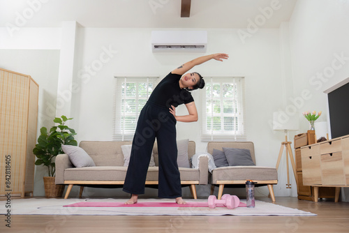 Fat Woman Successfully Loses Weight Through Home Exercise Routine, Demonstrating Dedication and Healthy Lifestyle in Modern Living Room Setting