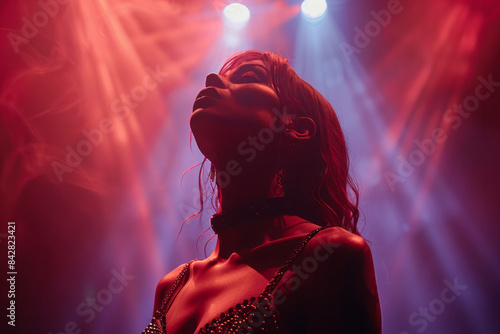 Elegant drag queen performing under bright stage lights, exuding confidence and flair,