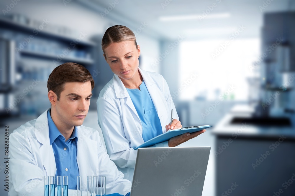 Science, research workers in laboratory with data. Science, research workers in laboratory with data.