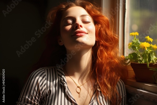 Beautiful redheaded redheaded woman in striped t-shirt closes her eyes and smiling, generative IA © Gabriel
