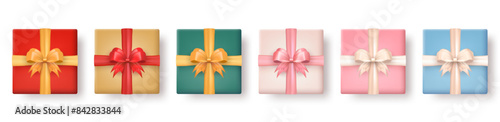 Set of 3d realistic colorful gift boxes with silk bows top view isolated on transparent background. Three dimensional present wrap packages with crossed ribbons. View from above