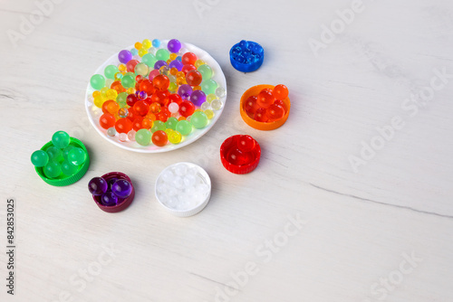 Colored balls of hydrogel, kids game, education concept. photo