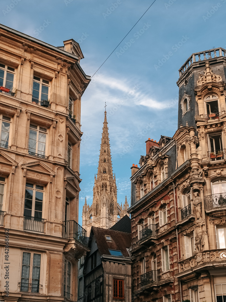 Φωτογραφία Facades of houses in Rouen Old Town. Spire of a church