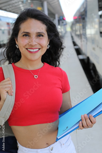 Pretty female student taking a train photo