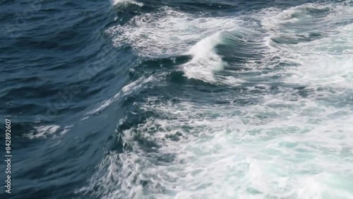 White ocean waves with foam close-up shot
