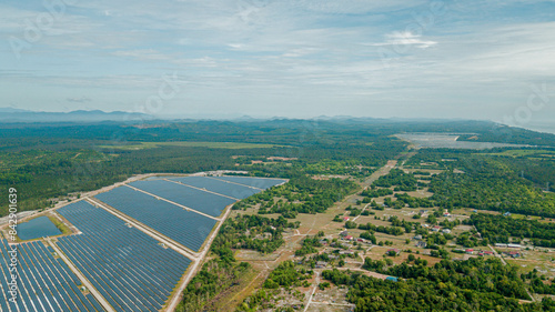 Panoramic aerial drone view of solar panels farm scenery at Pantai Jambu Bongkok, Marang, Terengganu, Malaysia.