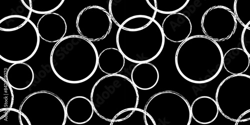 Abstract geometric seamless pattern with textured circles on black. Repeated geometry brush strokes texture. Great for textile, fabric, wallpaper, wrapping, scrapbook and packaging