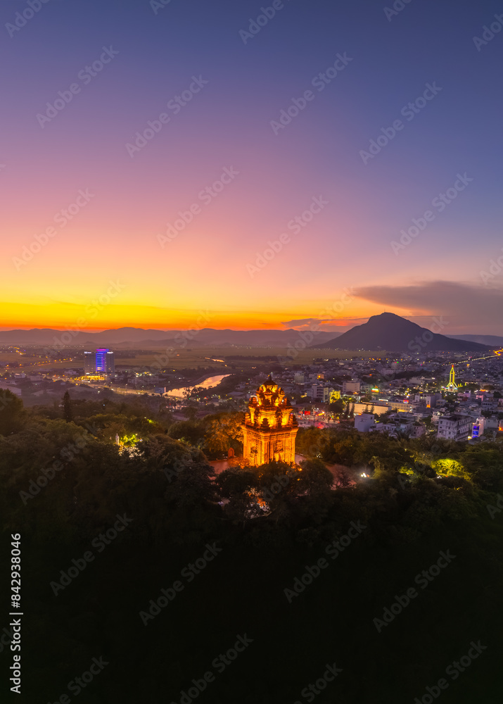 Fototapeta premium Aerial view of Nhan temple, tower is an artistic architectural work of Champa people in Tuy Hoa city, Phu Yen province, Vietnam. Sunset view