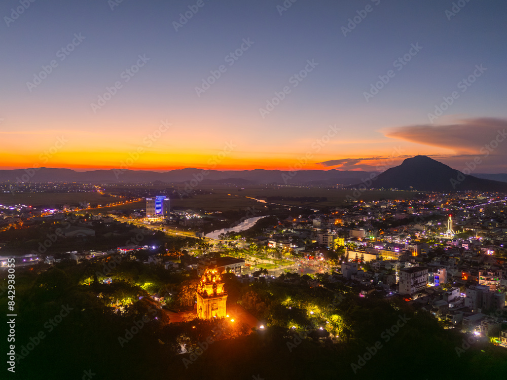 Aerial view of Nhan temple, tower is an artistic architectural work of Champa people in Tuy Hoa city, Phu Yen province, Vietnam. Sunset view Aerial view of Nhan temple, tower is an artistic architectural work of Champa people in Tuy Hoa city, Phu Yen province, Vietnam. Sunset view