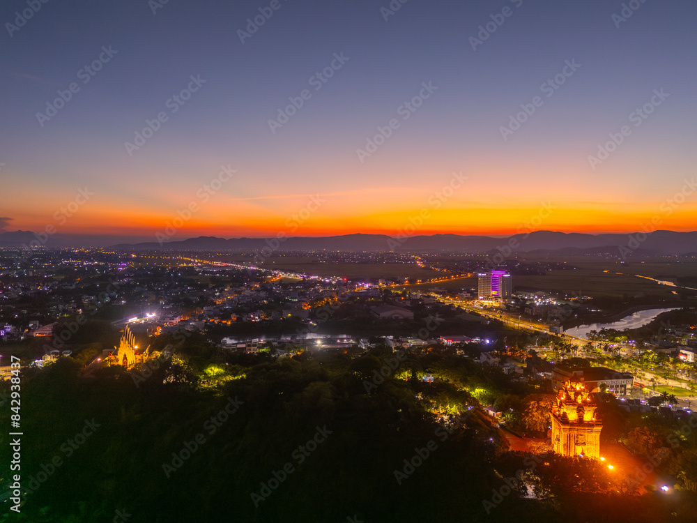 Aerial view of Nhan temple, tower is an artistic architectural work of Champa people in Tuy Hoa city, Phu Yen province, Vietnam. Sunset view Aerial view of Nhan temple, tower is an artistic architectural work of Champa people in Tuy Hoa city, Phu Yen province, Vietnam. Sunset view