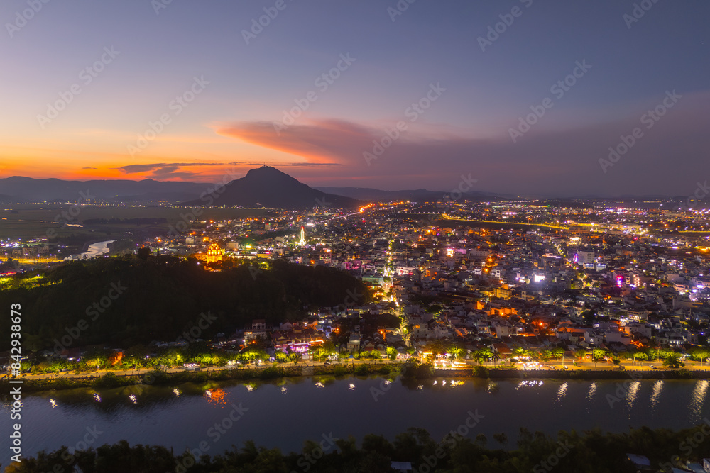 Naklejka premium Aerial view of Nhan temple, tower is an artistic architectural work of Champa people in Tuy Hoa city, Phu Yen province, Vietnam. Sunset view