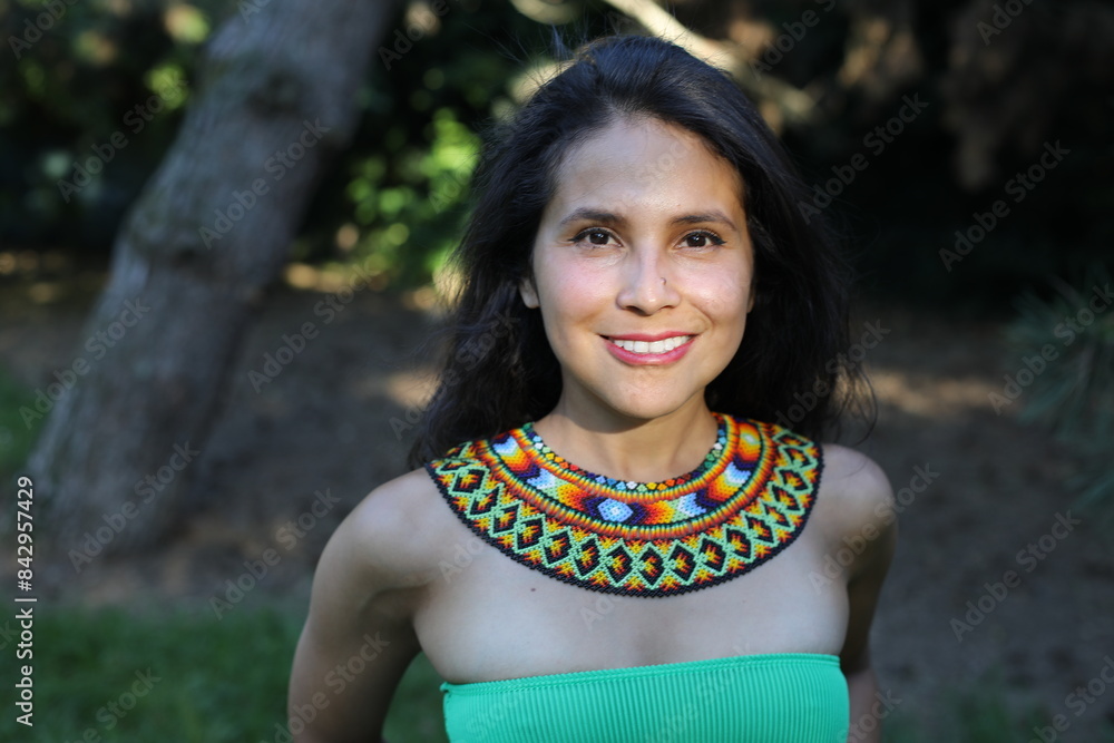 Native American woman with traditional colorful outfit Native American woman with traditional colorful outfit