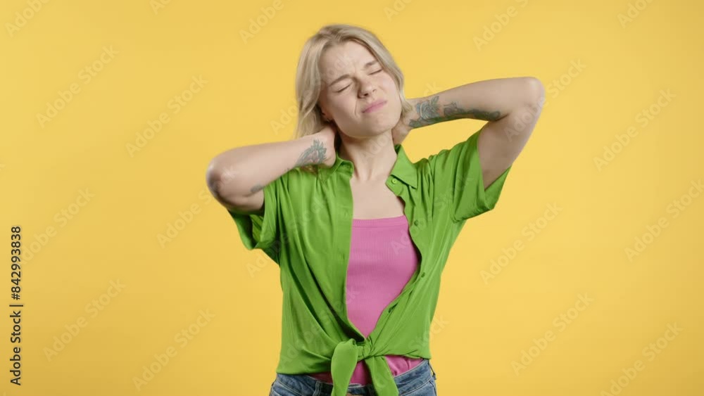 Tired young woman feeling pain in neck joint, massaging muscles, rubbing head. Tired young woman feeling pain in neck joint, massaging muscles, rubbing head.