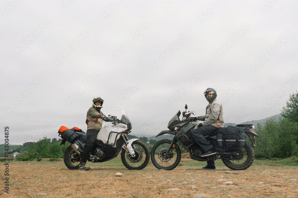Motorcyclists friends, motorcycle trip on adventure enduro motorcycles in mountains