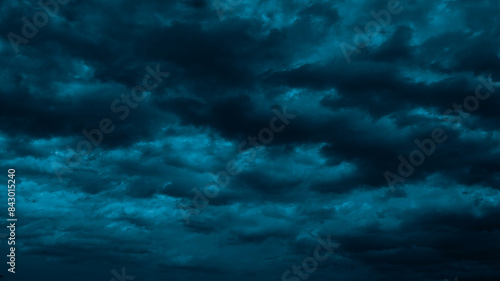 Obraz na płótnie Night sky with clouds. Black dark petrol blue tone. Dramatic background. Storm thunder rain cloudy gloomy. Moonlight midnight. Scary creepy ominous. Mystical or horror war concept. w salonie