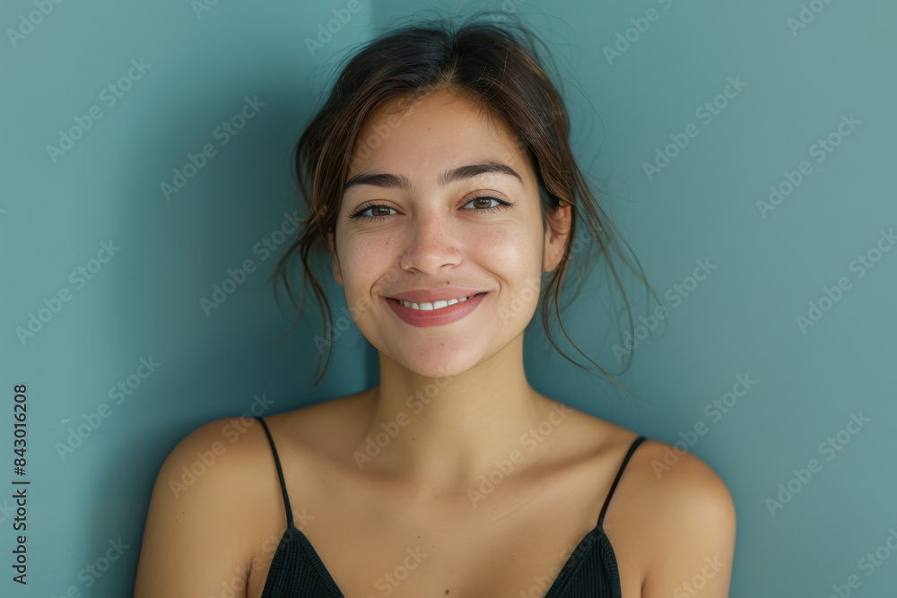A close up portrait of a young woman with a subtle smile A close up portrait of a young woman with a subtle smile