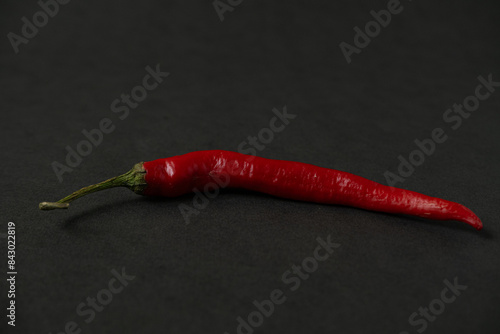 red chillies on the dark table