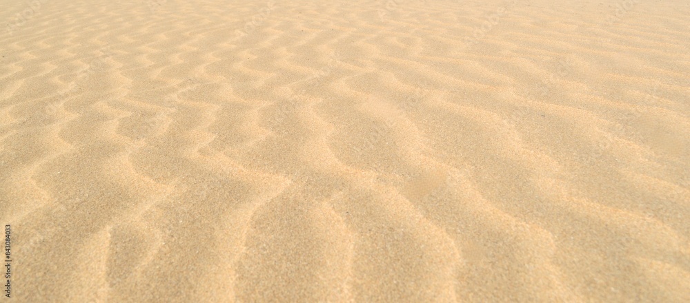 Flat lay beach sand texture background. Sea sand surface rippled sand dune. Brown sea sand background with copy space for product presentation. Minimal summer concept Flat lay beach sand texture background. Sea sand surface rippled sand dune. Brown sea sand background with copy space for product presentation. Minimal summer concept