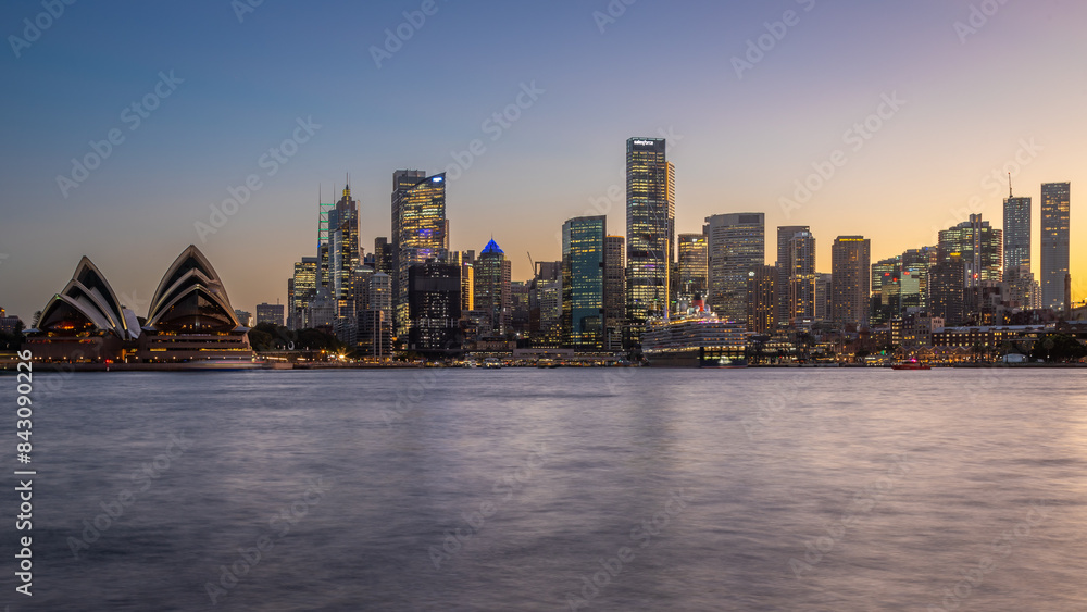 Fototapeta premium Long exposure of the amazing Sydney Harbour Bridge and Sydney's Downtown from the north bank namely Mattawunga, at sunset, Australia