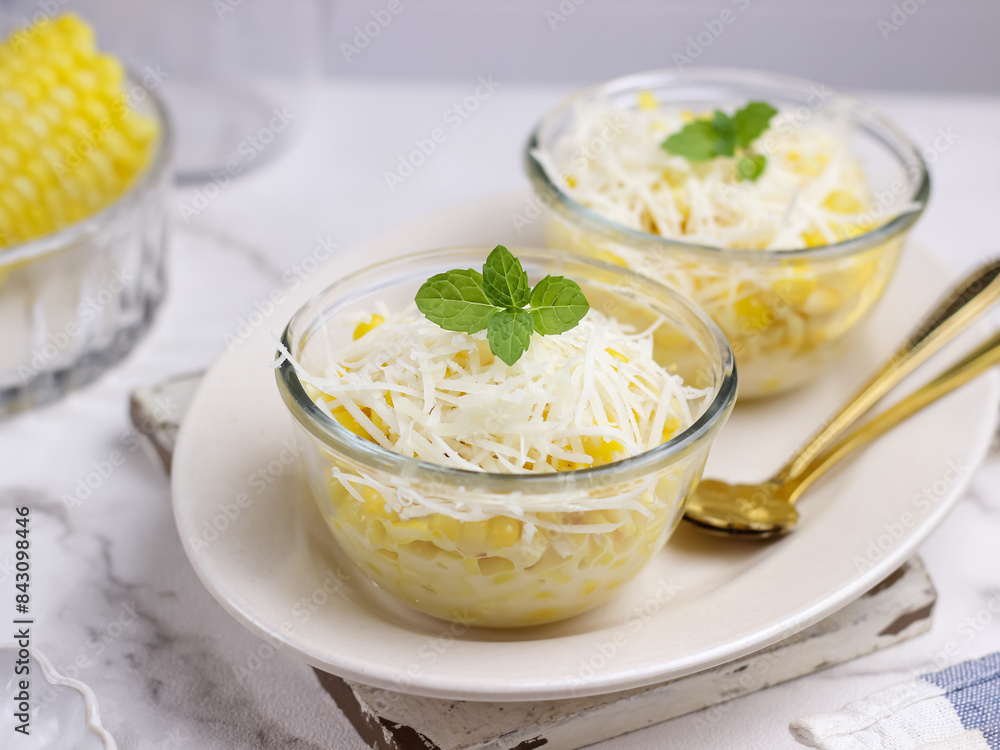 Jasuke (Jagung Susu Keju), Indonesian sweet snack made from steamed sweet corn mixed with milk and grated cheese Jasuke (Jagung Susu Keju), Indonesian sweet snack made from steamed sweet corn mixed with milk and grated cheese