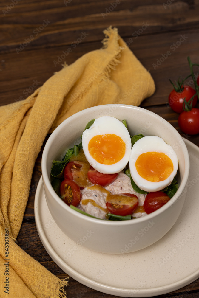 Light healthy salad with tuna, spinach, tomatoes and boiled egg Light healthy salad with tuna, spinach, tomatoes and boiled egg