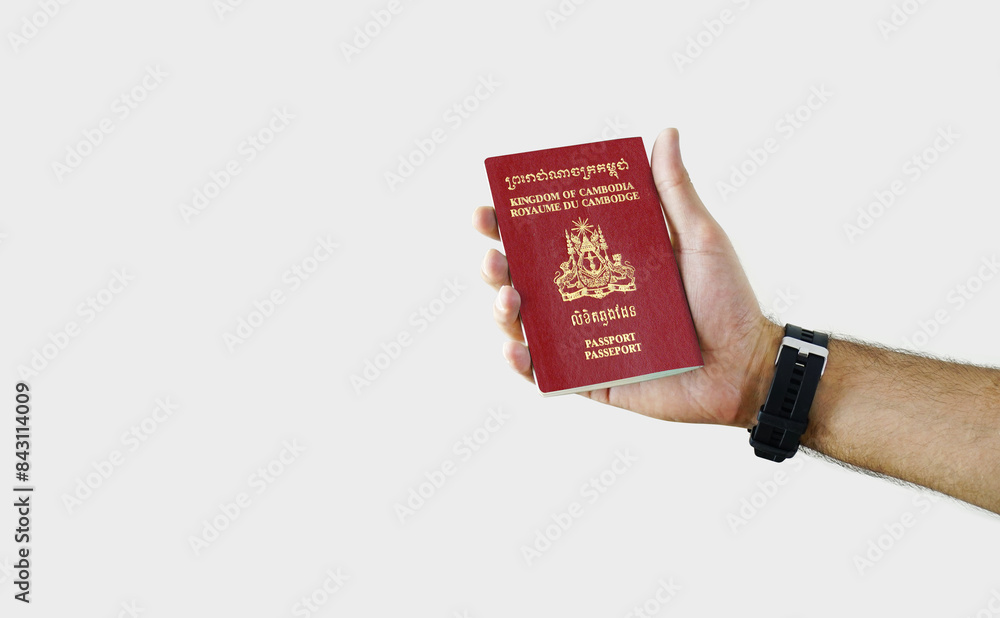 Man holding Cambodia Passport in hand on white background with copy space - Cambodian Man holding Cambodia Passport in hand on white background with copy space - Cambodian