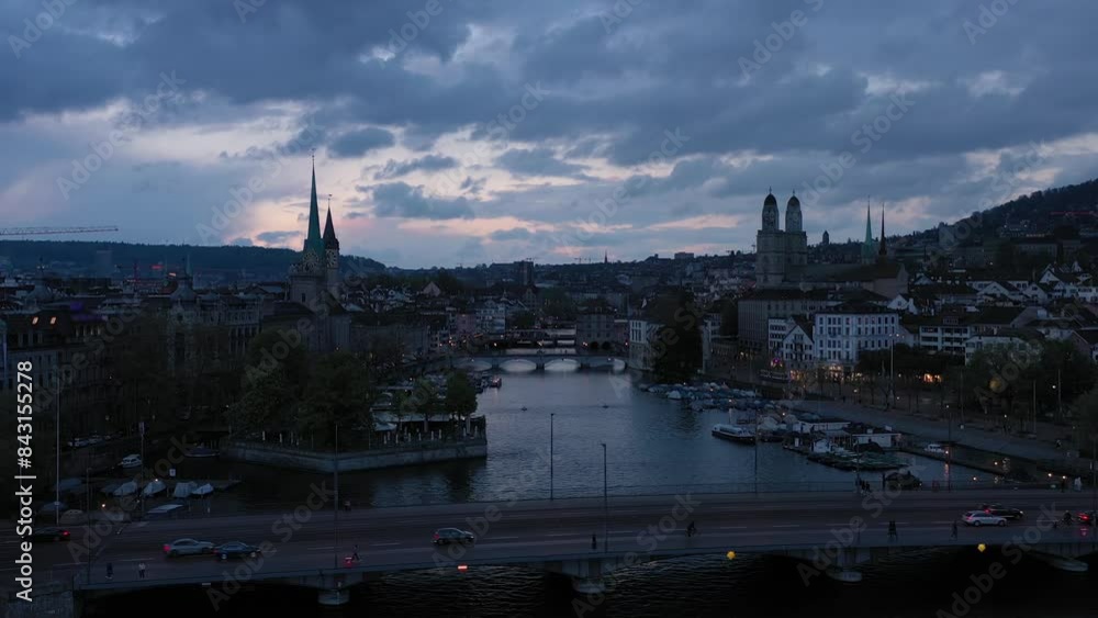 Zurich Old Town and Limmat River at Evening Twilight. Switzerland. Dramatic Clouds. Aerial View. Drone Moves Upwards Zurich Old Town and Limmat River at Evening Twilight. Switzerland. Dramatic Clouds. Aerial View. Drone Moves Upwards