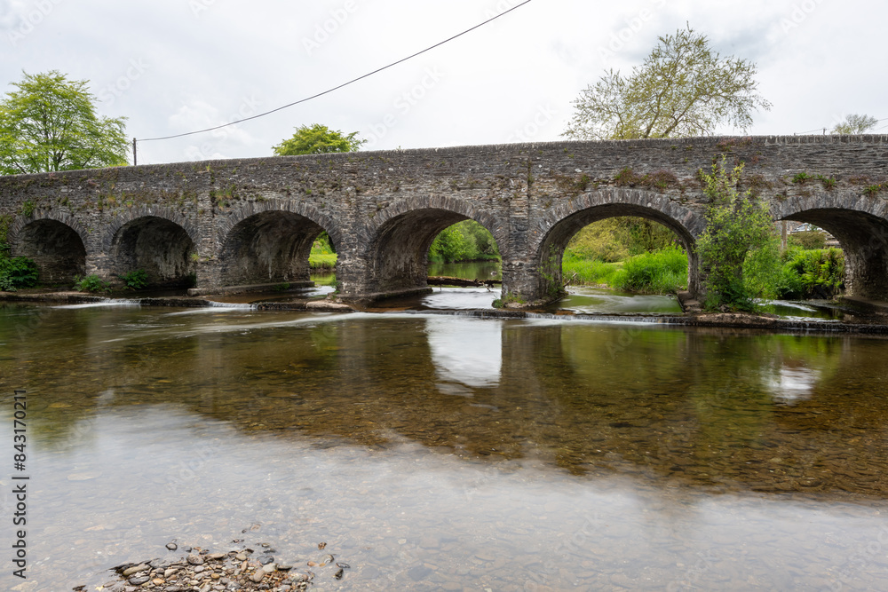 Fototapeta premium The river Barle flowing under Withypool bridge in Exmoor National Park