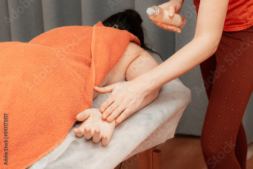 Woman therapist give a massage photo