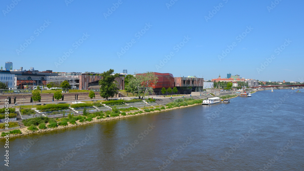 Vistula Boulevards promenade on the west side of the Vistula river. Popular place for weekend walks. View from Swietokrzyski bridge. Warsaw, Poland Vistula Boulevards promenade on the west side of the Vistula river. Popular place for weekend walks. View from Swietokrzyski bridge. Warsaw, Poland