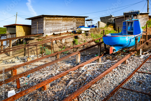 Blue fishing boat on a slipway, pulled ashore at the Fisherman's Bay in the village of Sinemorets, Tsarevo Municipality, Province of Burgas, Bulgarian Black Sea coast