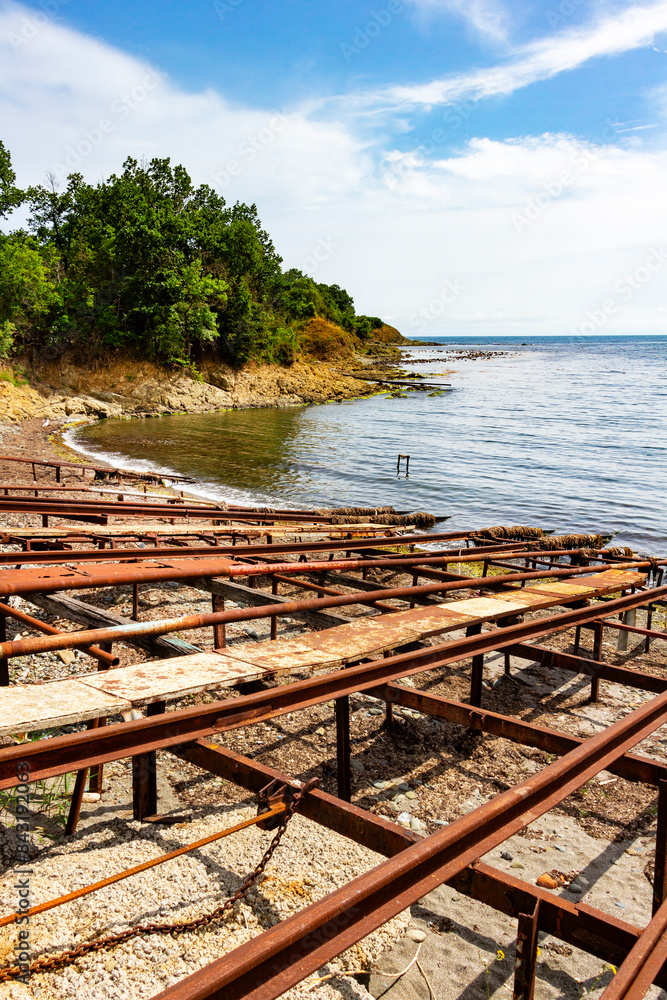 Fototapeta premium Empty, old and rusty slipways of the Fisherman's bay in the village of Varvara, Tsarevo Municipality, Burgas Province, Bulgarian Black Sea coast