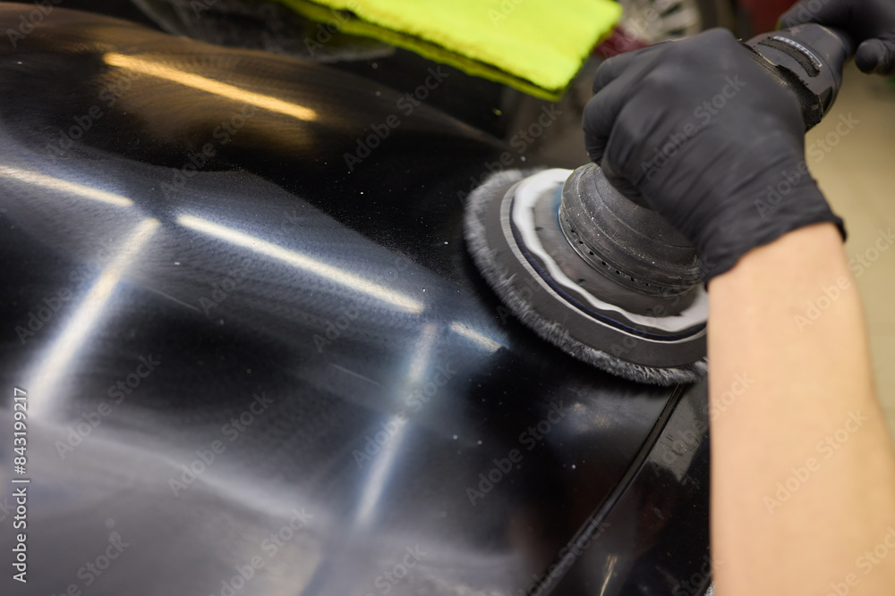 Person using machine to polish cars automotive exterior Person using machine to polish cars automotive exterior