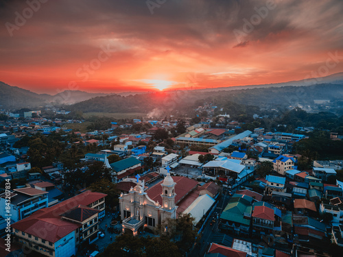 Photography view of the city at sunset with a church on the main foreground