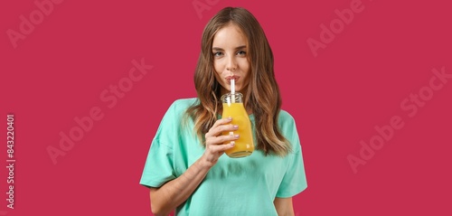 Beautiful young woman drink...
