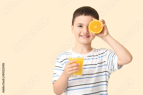 Cute little boy with orange...
